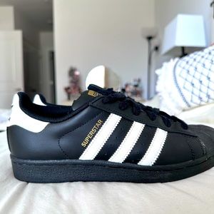 Adidas Superstar black & white sneakers.